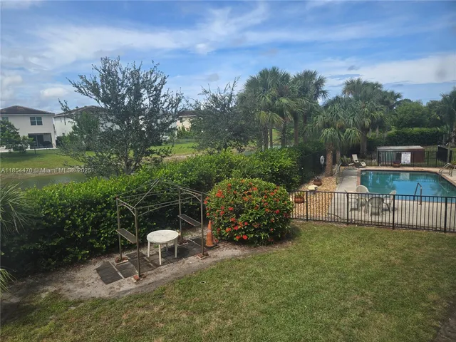 a view of a lake with sitting space and garden view