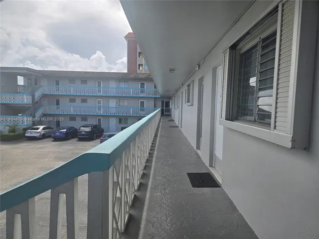 a view of a hallway with stairs