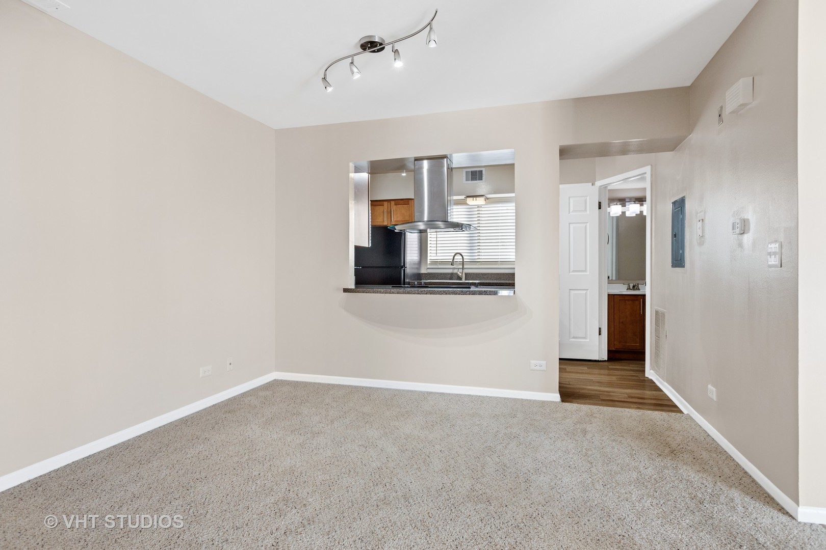 1919 Brookdale Road, Unit 108 Naperville, IL 60563 - Photo 28 of 53 a view of a big room with wooden floor and a bathroom