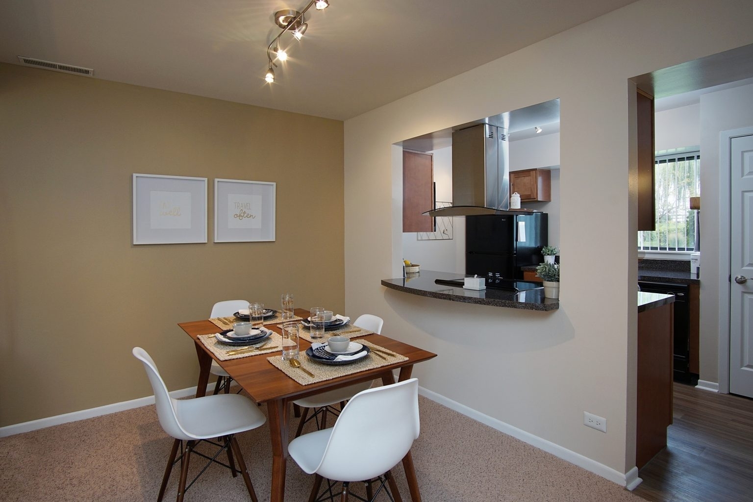 1919 Brookdale Road, Unit 108 Naperville, IL 60563 - Photo 30 of 53 a view of a dining room with furniture and wooden floor