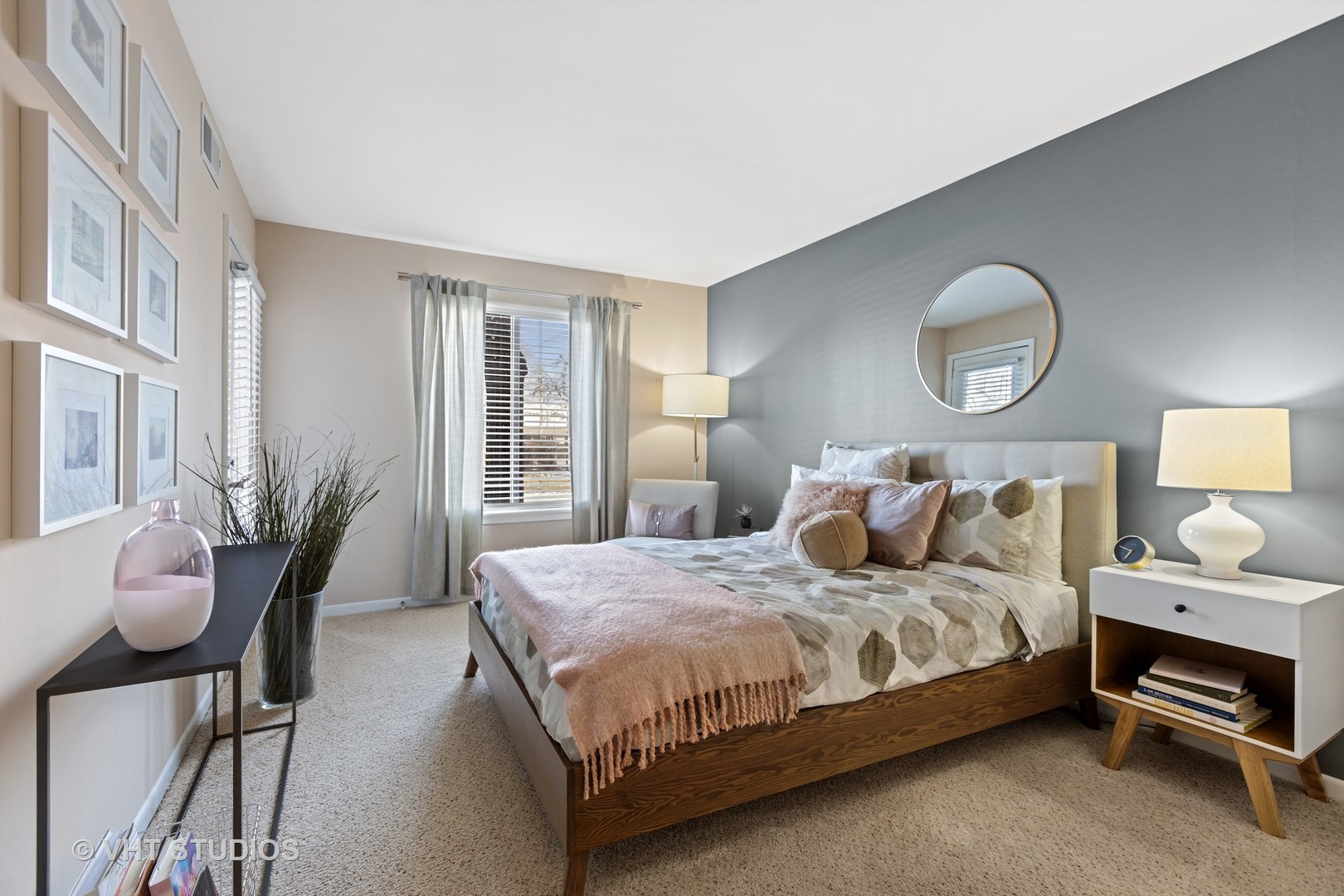 1919 Brookdale Road, Unit 108 Naperville, IL 60563 - Photo 35 of 53 a bedroom with a bed and wooden floor