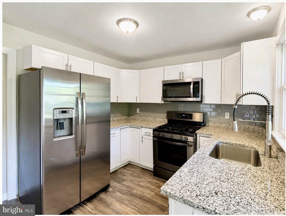 1010 Nottingham Street Culpeper, VA 22701 - Photo 3 of 21 a kitchen with a refrigerator sink and microwave