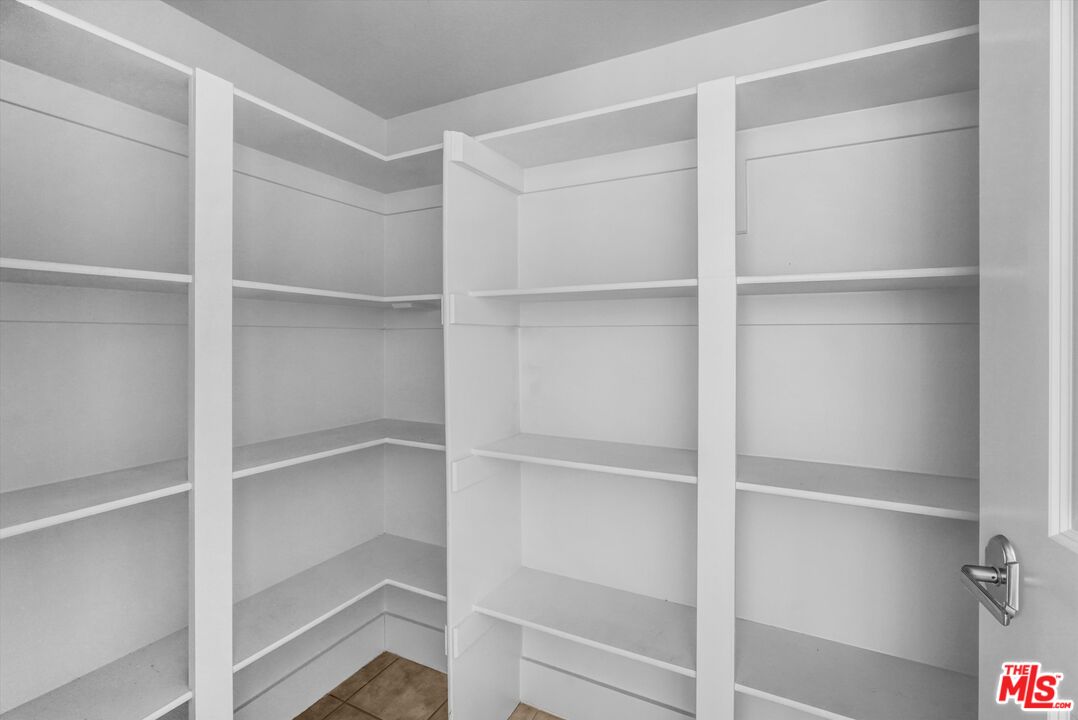 7249 Franklin Avenue, Unit 204 Los Angeles, CA 90046 - Photo 10 of 17 a view of walk in closet with empty racks