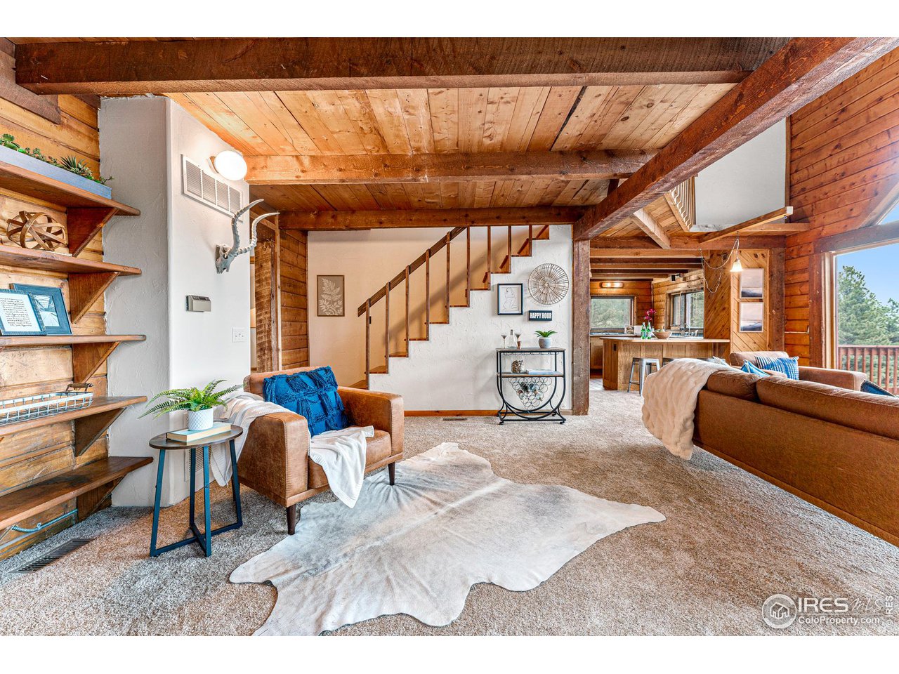3907 Ridge Road Nederland, CO 80466 - Photo 5 of 40 Reading nook by wood burning fireplace