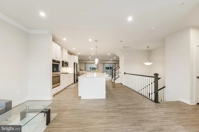 a view of kitchen with furniture and wooden floor