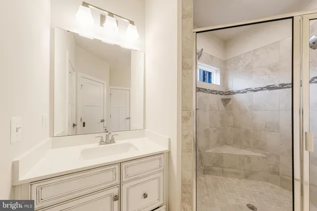 a bathroom with a shower and a sink