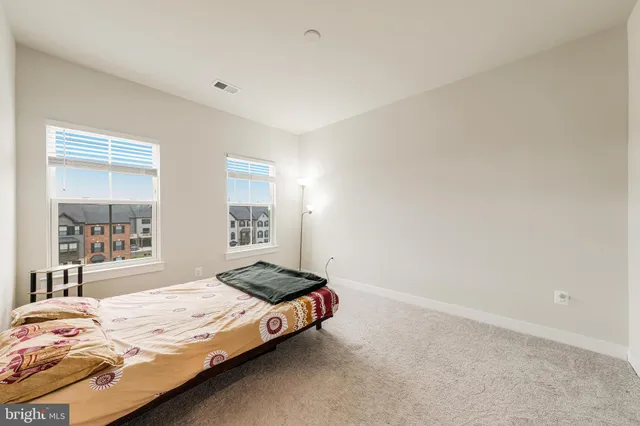 a room with a bed and a window