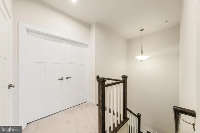 a bathroom with a double vanity sink toilet and a mirror