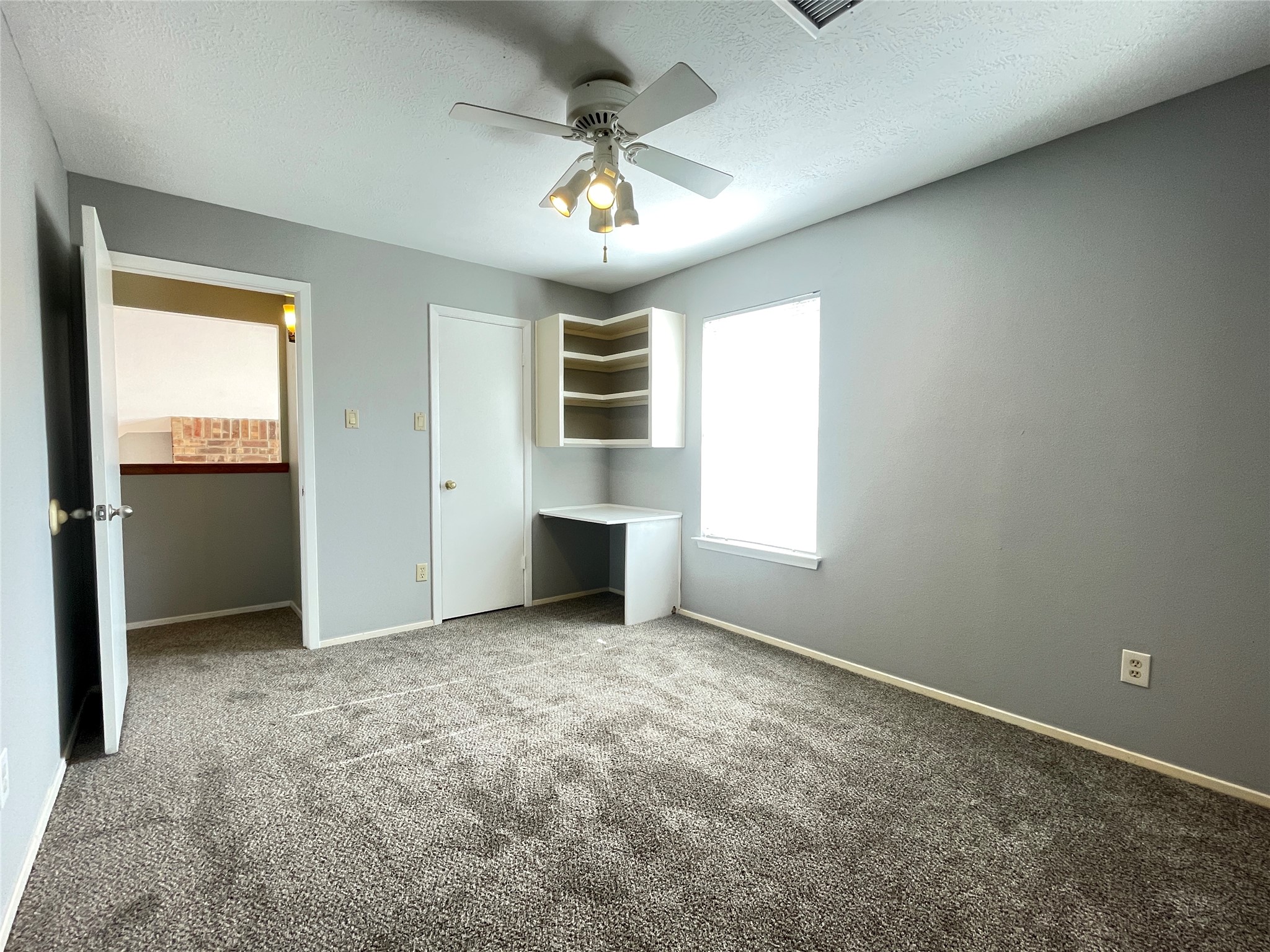 5006 Temple Bell Drive Spring, TX 77388 - Photo 22 of 27 Secondary bedroom 2 featuring built-in desk