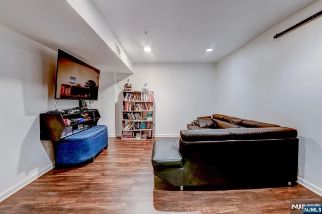 a view of a workspace with furniture and a potted plant
