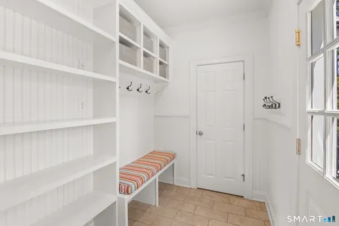 a room with a chair and a window