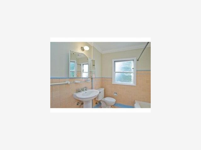 332 Dwight Road Burlingame, CA 94010 - Photo 7 of 9 a bathroom with a sink and a mirror