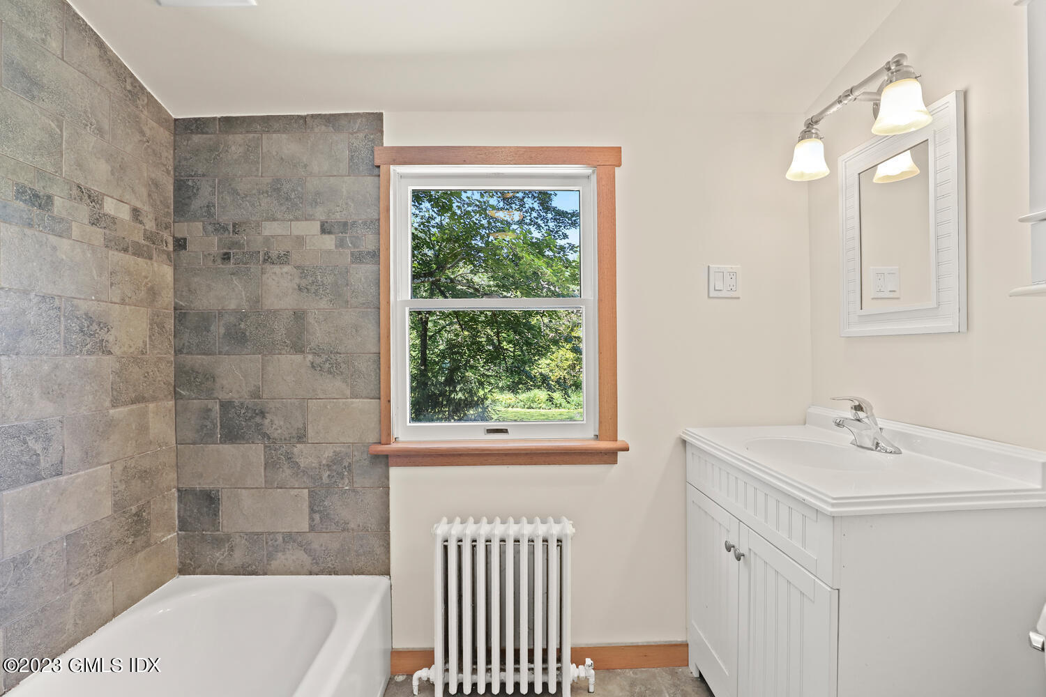 220 Sheep Hill Road, Unit 2 Riverside, CT 06878 - Photo 11 of 20 a bathroom with a sink a toilet a shower and a bathtub