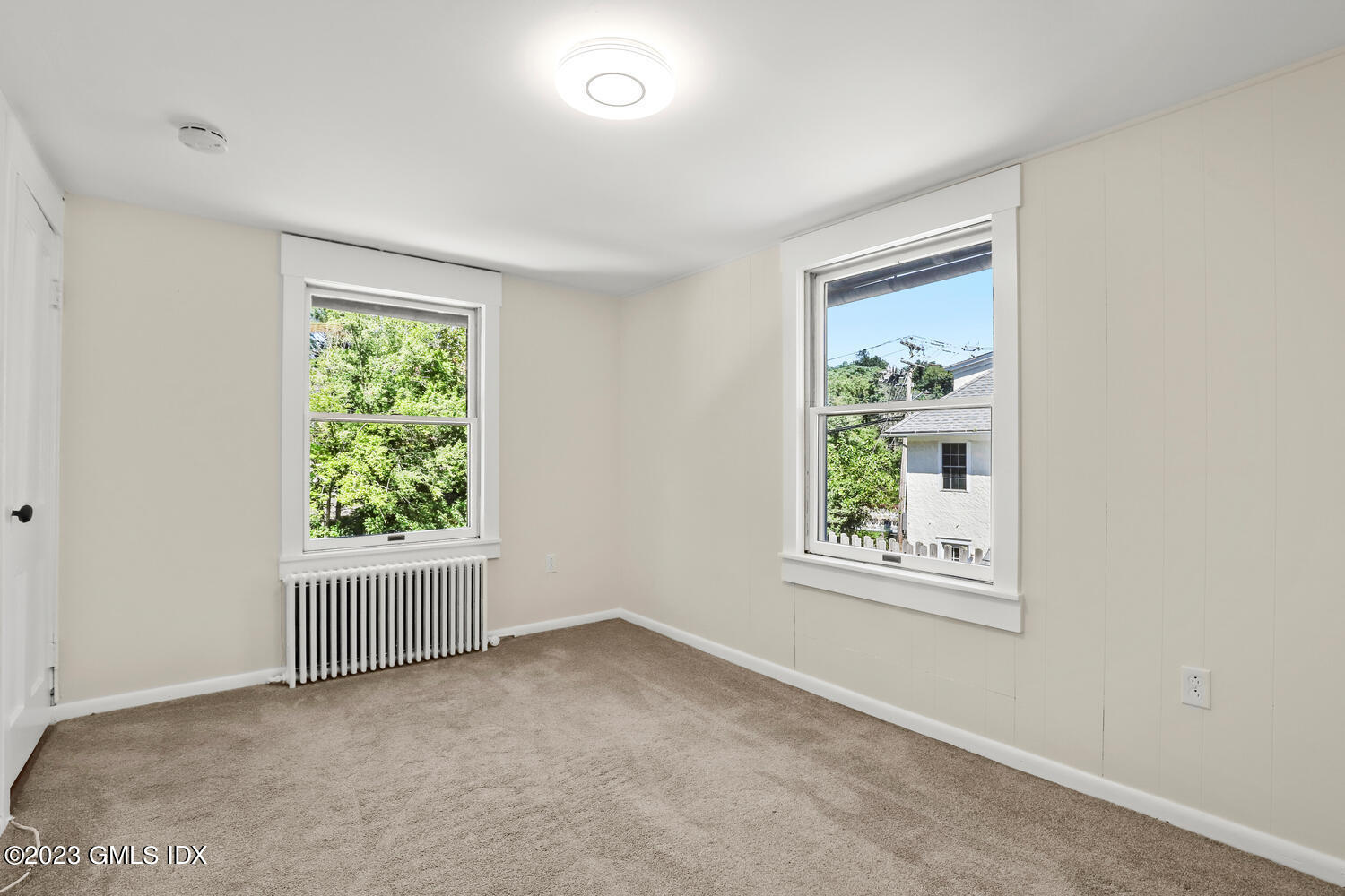 220 Sheep Hill Road, Unit 2 Riverside, CT 06878 - Photo 14 of 20 an empty room with windows