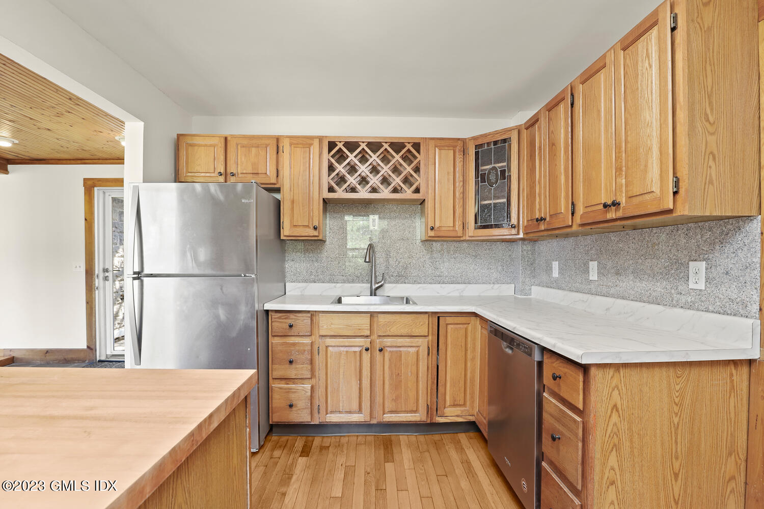 220 Sheep Hill Road, Unit 2 Riverside, CT 06878 - Photo 6 of 20 a kitchen with stainless steel appliances granite countertop a sink stove and refrigerator