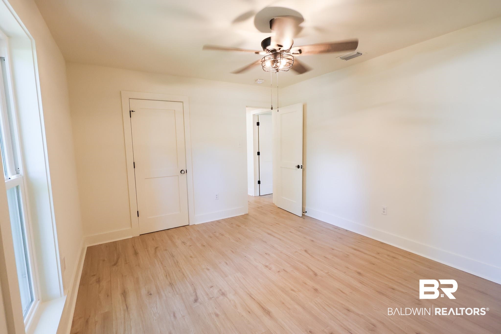 12190 Pecan Grove Street Magnolia Springs, AL 36555 - Photo 18 of 45 Unfurnished bedroom featuring light wood-type flooring and ceiling fan