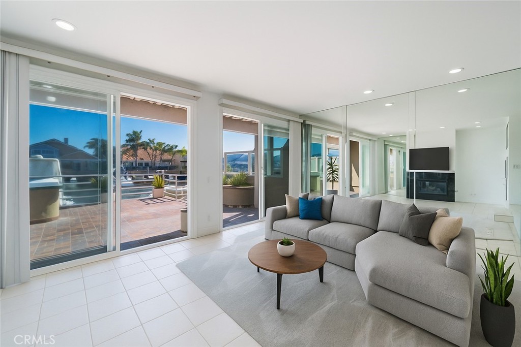 3310 Tempe Drive Huntington Beach, CA 92649 - Photo 1 of 52 a living room with furniture and a large window