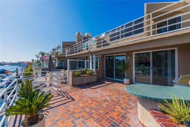 a kitchen with stainless steel appliances granite countertop a sink refrigerator and cabinets