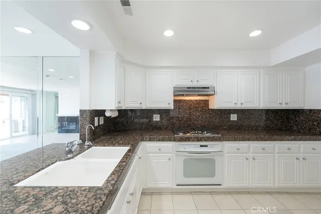a view of a livingroom with a fireplace and window