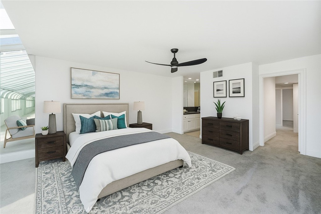 3310 Tempe Drive Huntington Beach, CA 92649 - Photo 19 of 52 a bedroom with a bed and a chandelier