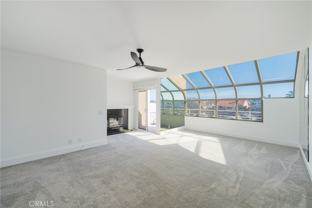 3310 Tempe Drive Huntington Beach, CA 92649 - Photo 21 of 52 a view of a livingroom with a fireplace and window