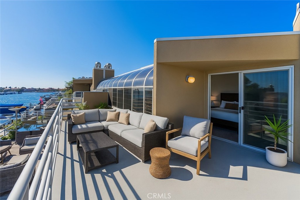 3310 Tempe Drive Huntington Beach, CA 92649 - Photo 23 of 52 a balcony with furniture and a potted plant