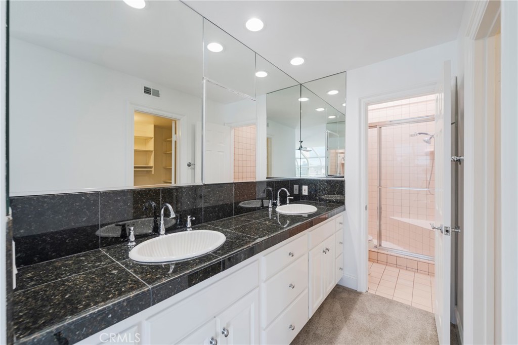 3310 Tempe Drive Huntington Beach, CA 92649 - Photo 25 of 52 a bathroom with double sink and a mirror