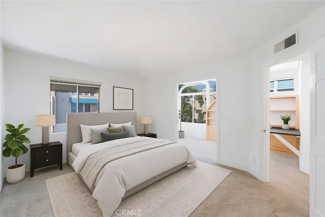 a bathroom with a granite countertop sink toilet a mirror and shower