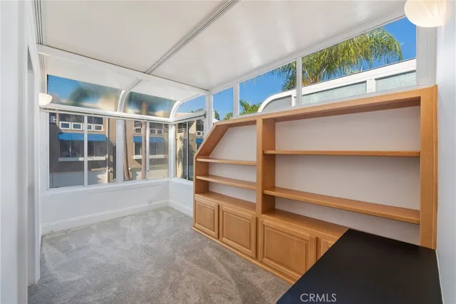 a view of a balcony with two chairs