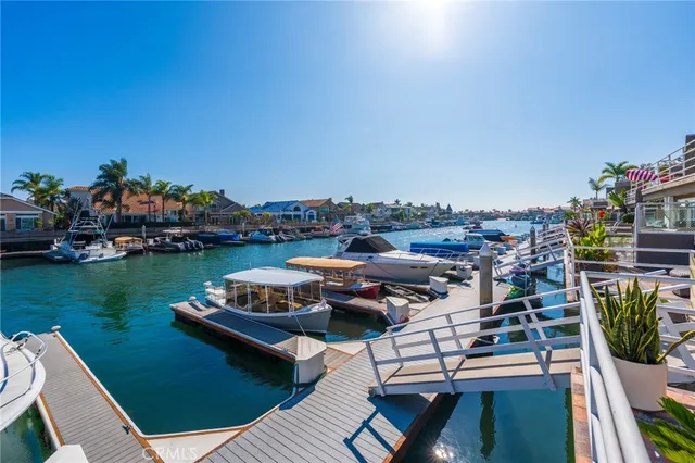 a front view of a house with plants