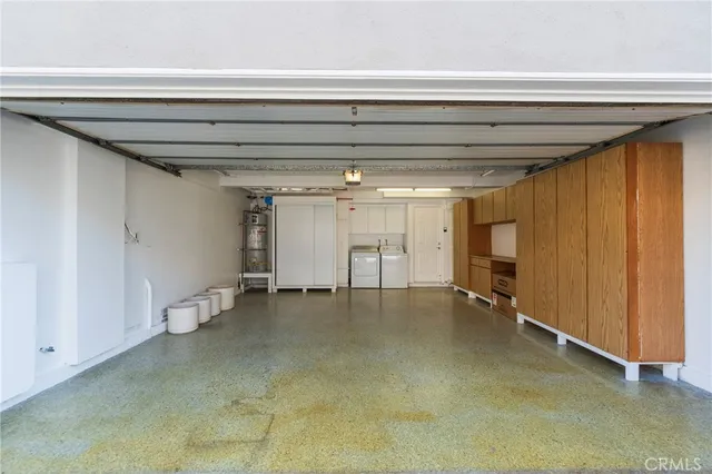 a view of a swimming pool with a yard and palm trees