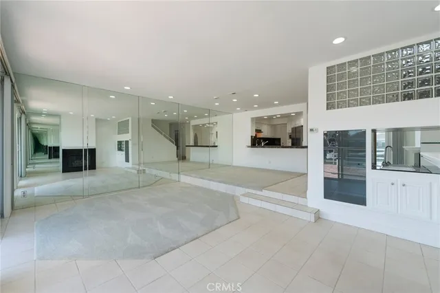 a view of a kitchen with a sink and a large window