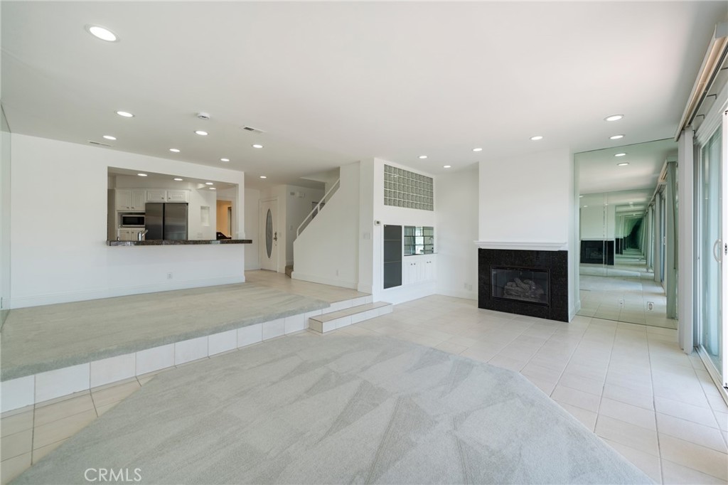 3310 Tempe Drive Huntington Beach, CA 92649 - Photo 4 of 52 a view of an empty room with a fireplace