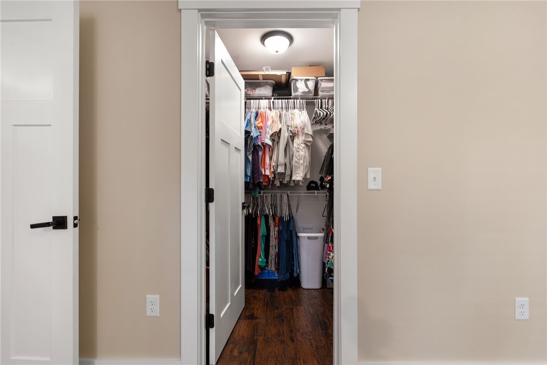 201 Hearthstone Drive Anderson, SC 29621 - Photo 34 of 49 Enter a well-organized walk-in closet, offering ample storage and rich hardwood flooring.