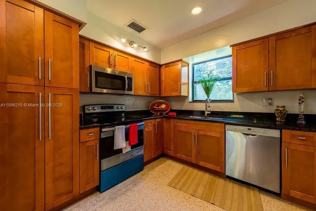 a bedroom with bed and a window