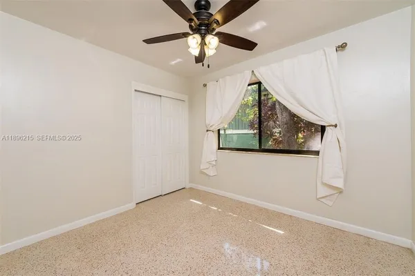 a view of a livingroom with a ceiling fan