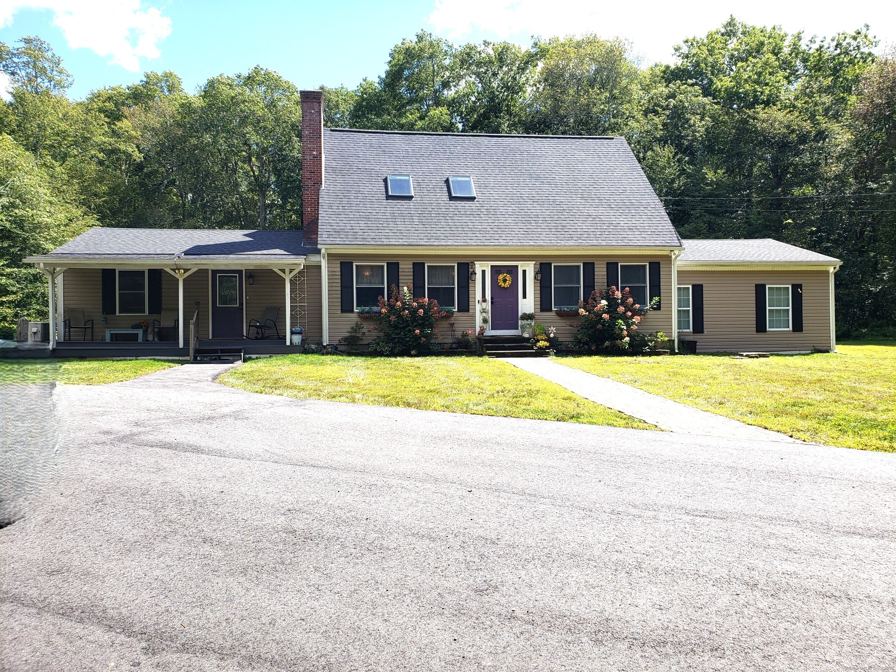 a view of a house with swimming pool and porch