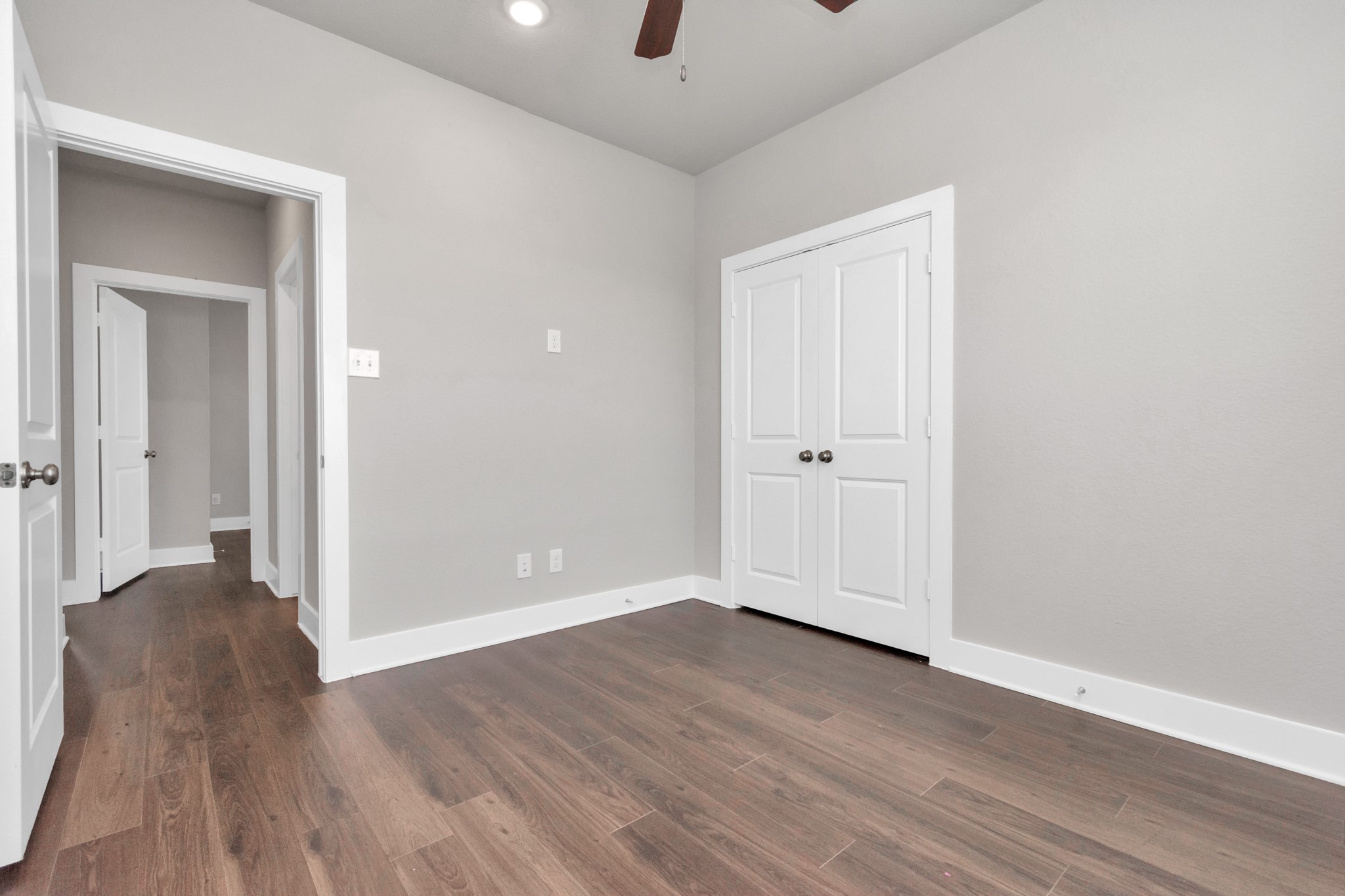 10502 Moon Valley Lane Rosharon, TX 77583 - Photo 13 of 23 an empty room with wooden floor and windows