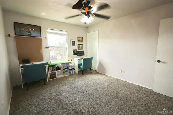a view of workspace with furniture and window