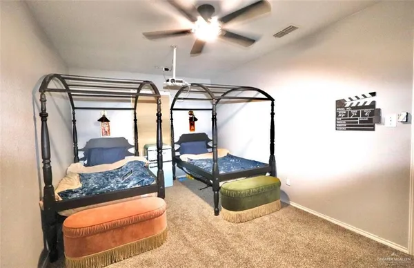 a bedroom with furniture and a chandelier