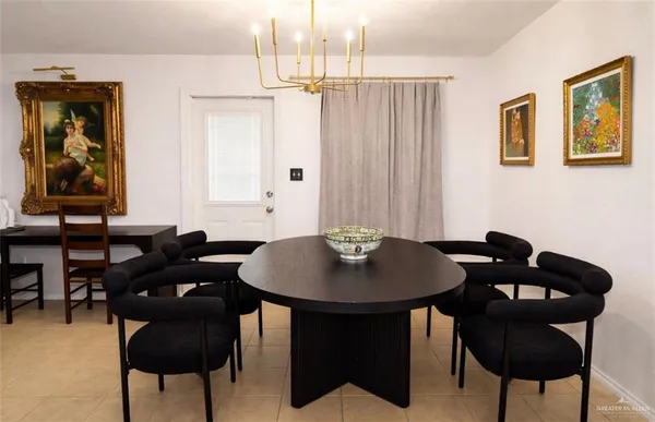 a table and chairs in a blue kitchen