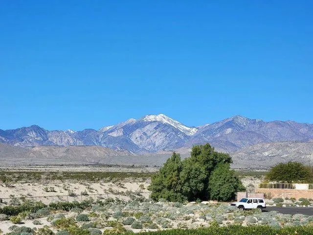a view of a lake with mountains in the background