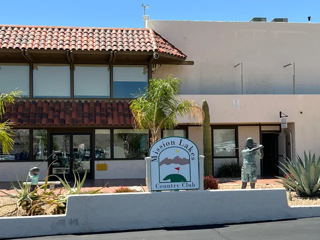 a front view of a house with sitting area
