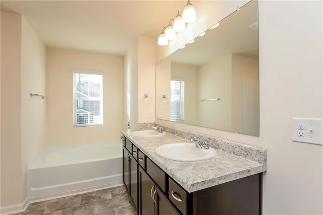 a bathroom with a sink a vanity and a mirror