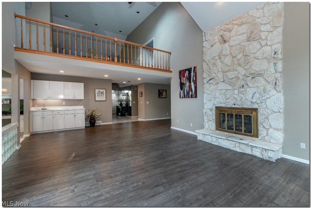 3225 Old Brainard Road Pepper Pike, OH 44124 - Photo 6 of 35 Incredible Two Story Great Room with New Flooring, Stone Fireplace, Built-ins with Wet Bar & French Doors Leading to the Large Deck