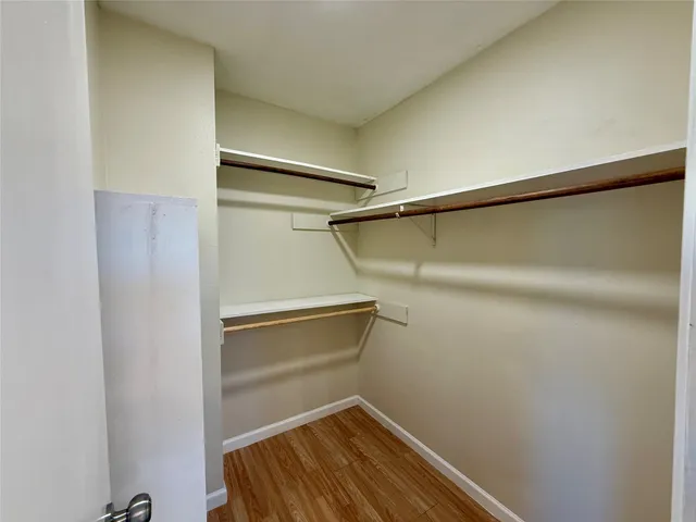 a bathroom with a toilet and shower