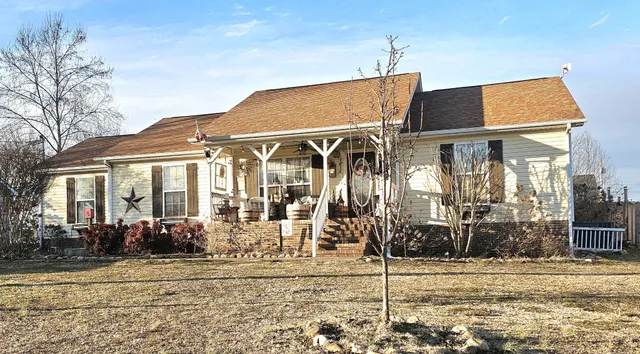 a front view of a house with a porch