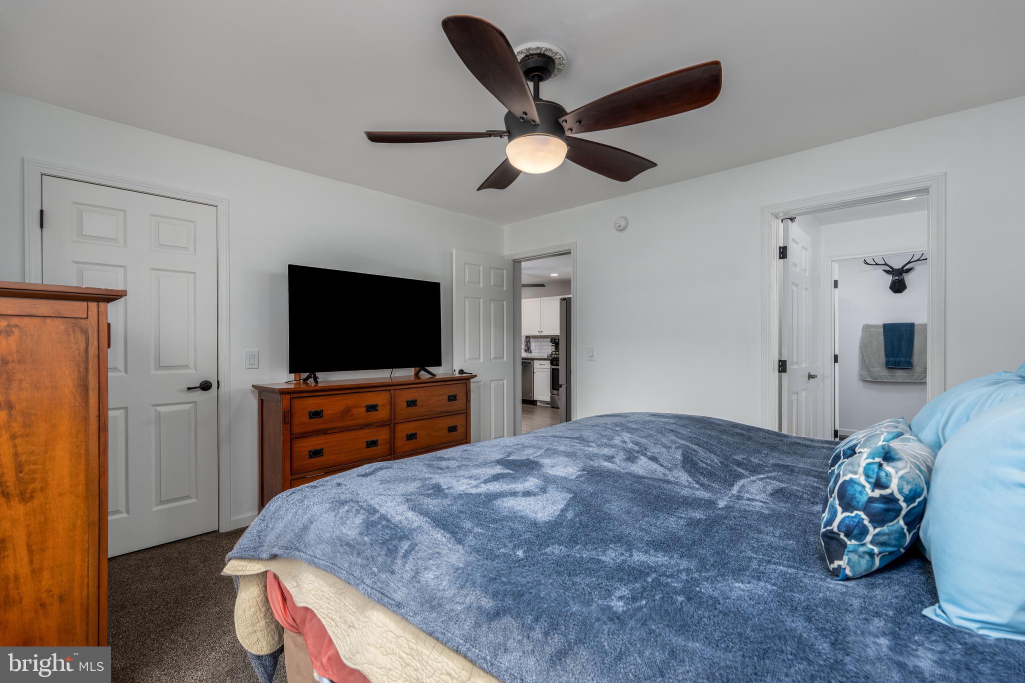 158 Main Street Hartly, DE 19953 - Photo 14 of 31 a bedroom with a bed and a flat screen tv