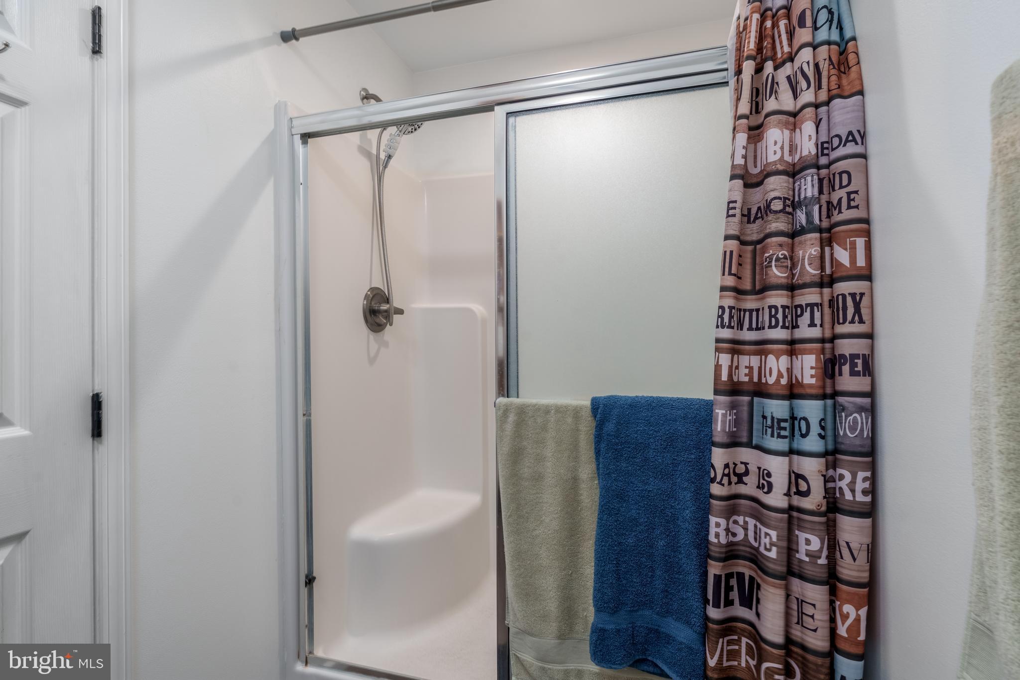 158 Main Street Hartly, DE 19953 - Photo 16 of 31 a bathroom with a shower and a glass door