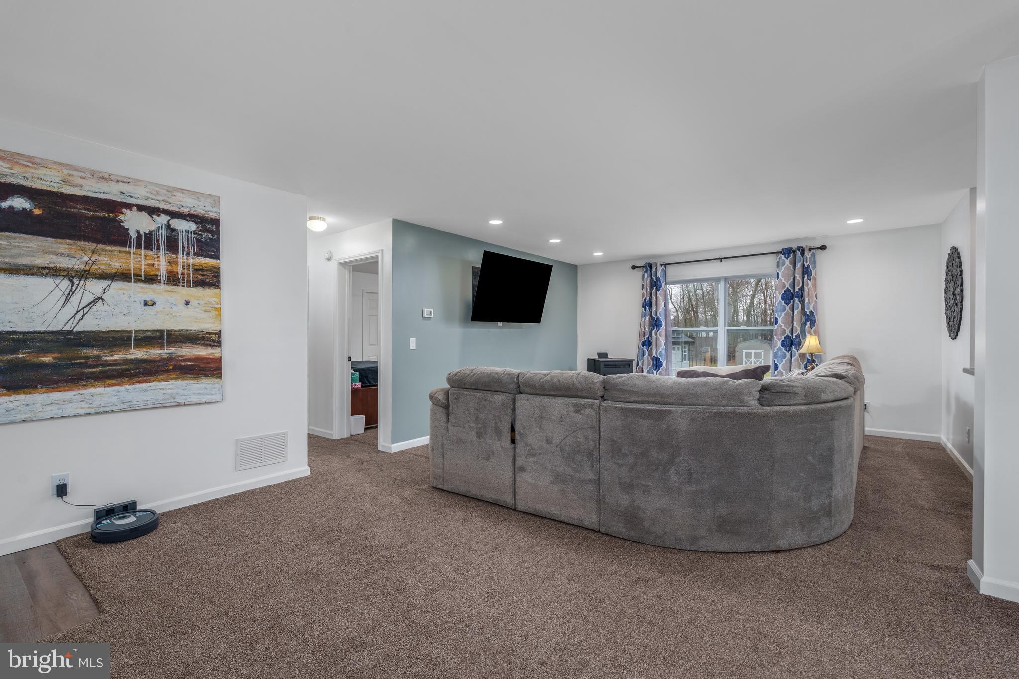 158 Main Street Hartly, DE 19953 - Photo 8 of 31 a living room with furniture and a flat screen tv